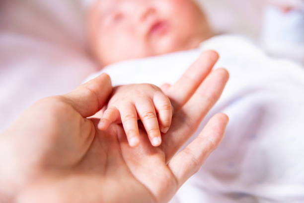 istock Dad will always support you.Holding baby hand 1139443282