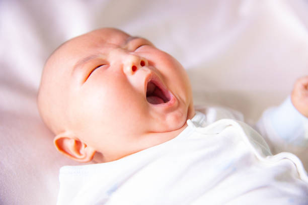 istock Newborn baby yawning 1139443846