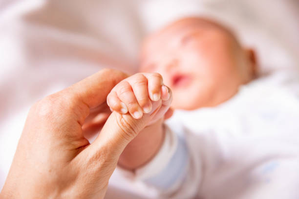 istock Dad will always support you.Holding baby hand 1139443854