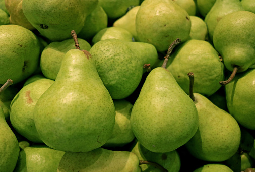 Pile of Fresh Green Anjou Pears in the Market of Santiago, Chile, South America