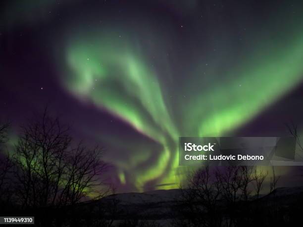Aurora Borealis With Strange Ghost Shape Stock Photo - Download Image Now - Kilpisjarvi Lake, Arctic, Astronomy
