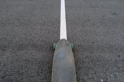 longboar board, skateboard, on the road