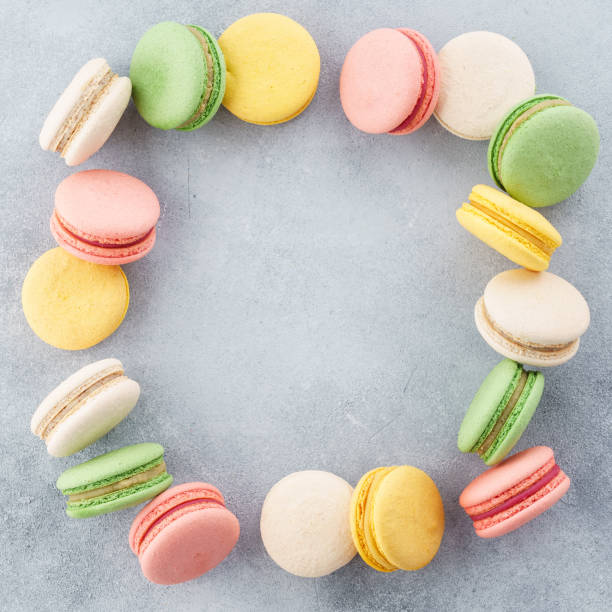 Frame made of colorful french macarons. Creative background.