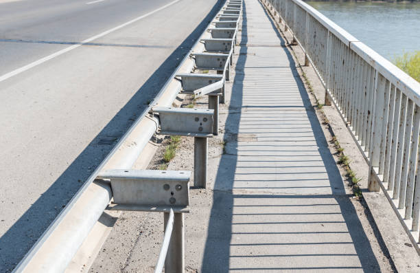 istock Damaged and broken security metal or iron fence on the bridge construction from car crash or traffic accident 1139451775