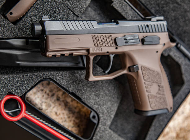 istock modern pistol on the table in case 1139452670