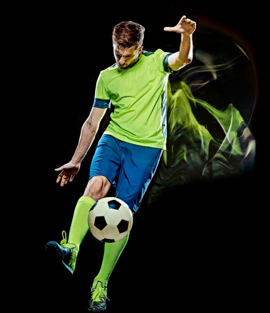 istock caucasian soccer player man isolated black background light painting 1139456421