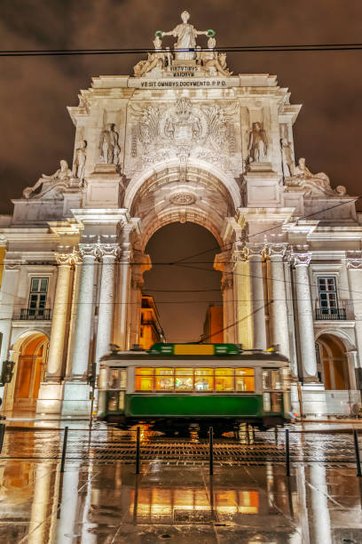 istock Green tram in Lisbon at night 1139457573