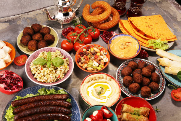istock Middle eastern or arabic dishes and assorted meze, concrete rustic background. Falafel. Turkish Dessert Baklava with pistachio. Halal food. Lebanese cuisine 1139459379