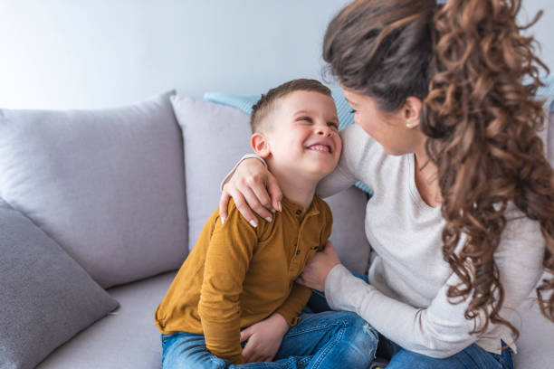istock Happy mom plays with her son at home. 1139459403