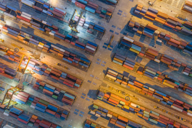 istock Logistics and transportation of Container Cargo ship and Cargo with working crane bridge in shipyard at sunrise, logistic import export and transport industry background 1139460323
