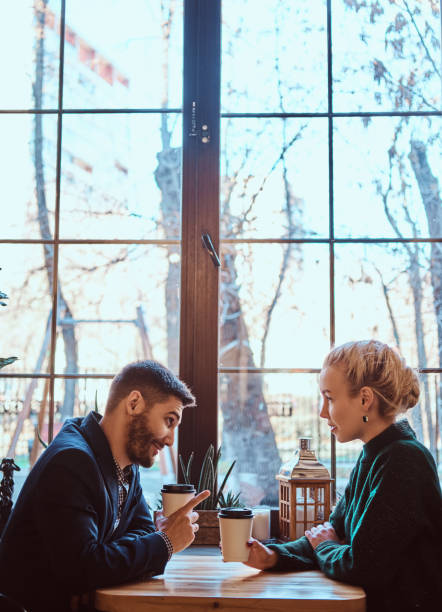istock Romantic couple in the cafe is drinking coffee and talking. 1139460646