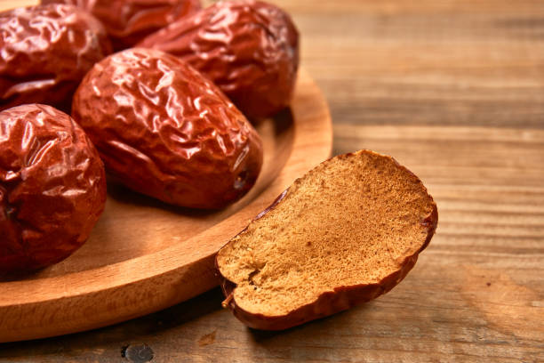 istock Jujube, Chinese dried red date fruit on wood 1139461668
