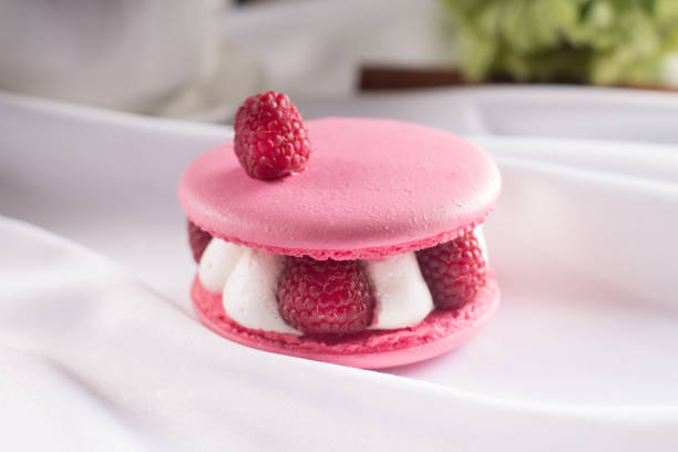 istock Pink macarons with vanilla cream, fresh raspberries 1139464589