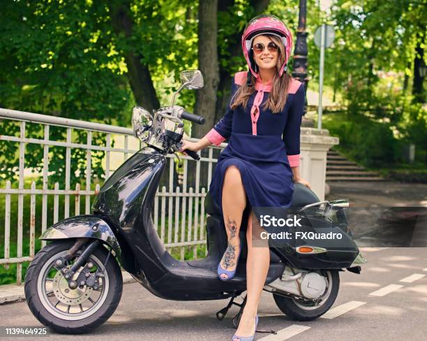 fornuft craft Tilbageholde A Woman In A Dress Sits On A Moto Scooter Stock Photo - Download Image Now  - Motorcycle, Pink Color, Women - iStock