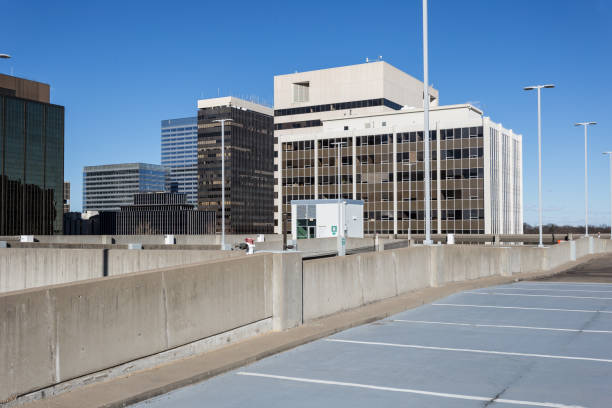 istock Empty parking deck leading to faceless office buildings 1139466765