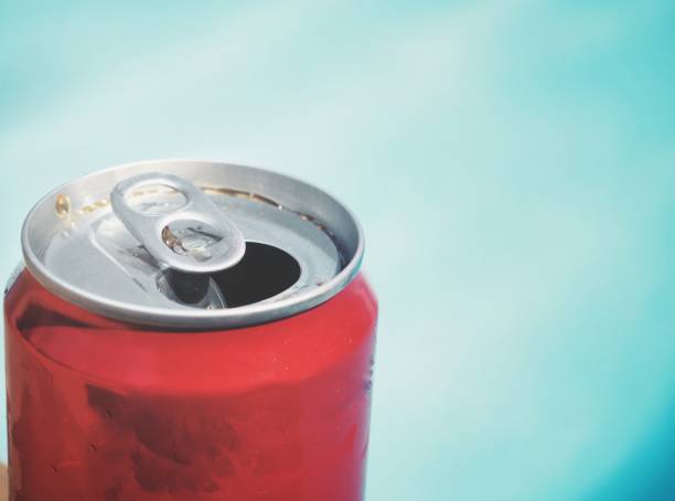 istock Cola can on hand swimming pool summer 1139467833