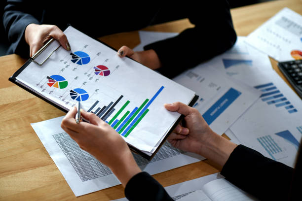istock Office staff is summarizing the work to present the management. 1139467957