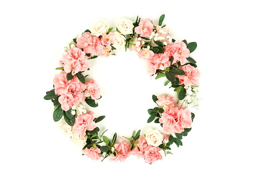 Wreath Flowers composition background . Pink flowers azalea pattern frame on white background. Top view. Copy space. Holiday concept