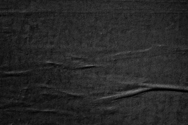 istock Dark black blank paper backgrounds creased crumpled surface old torn ripped posters grunge textures placard 1139468795