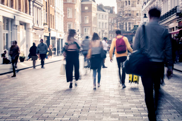 istock Motion blurred shoppers on city street 1139469326