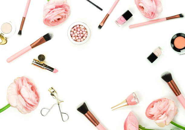 istock Makeup cosmetic accessories products  top view brushes, lipstick, pink flowers ranunkulus  on white background. Flat lay. Copy space 1139470076
