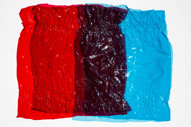 istock Thin sheet of multi coloured cellophane with shiny crumpled surface texture on white background, Abstract, Light & Shadow concept 1139470427