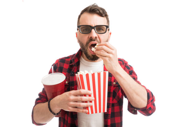istock Man Enjoying Film And Popcorn On White 1139470587