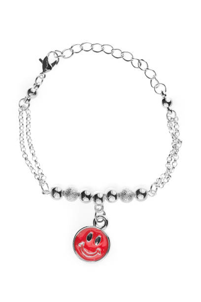 Adjustable silver bracelet with pearls and silver round beads and big red smiley on chain, isolated on white background