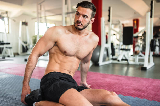 istock tired man resting at gym 1139471551