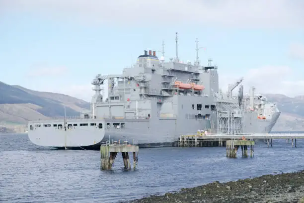 Grey battleship British royal fleet docked at naval base in Scotland for the Navy uk