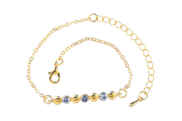 istock Gold bracelet with three diamonds, isolated on white background, clipping path included 1139471999