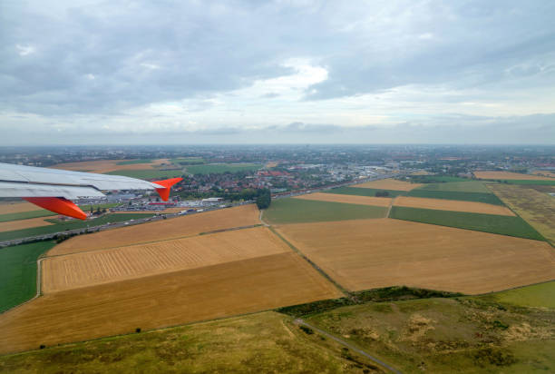 istock airplane flying over a cloudy landscape 1139472516