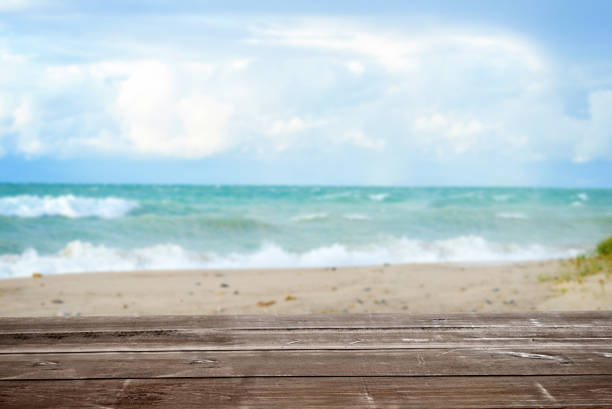 istock wood table with tropical summer ocean seascape background 1139472599