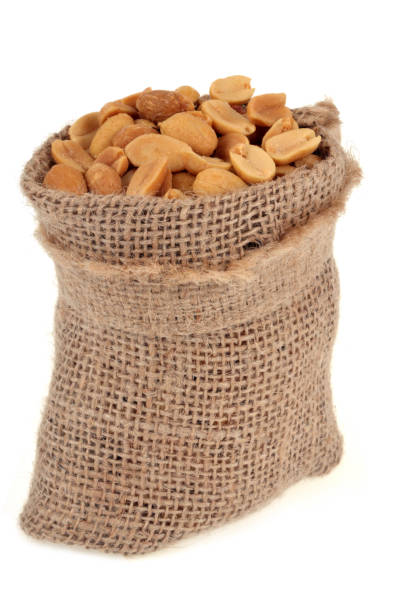 istock Bag of peanuts on white background 1139473071