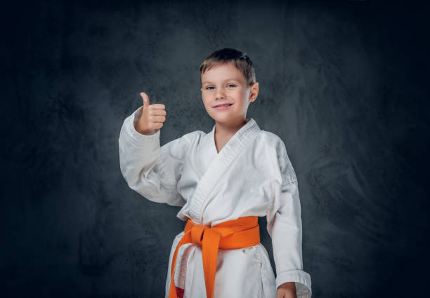 istock Preschooler boy dressed in a white karate kimono. 1139474065