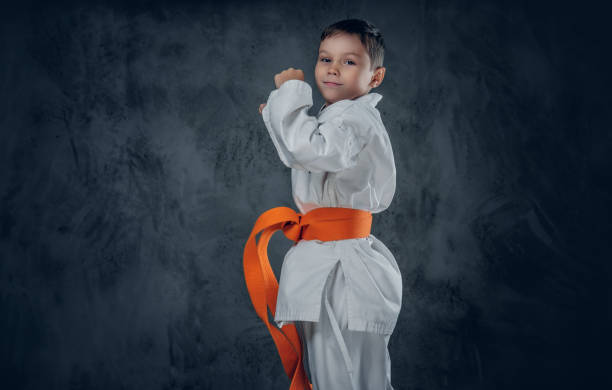 istock Preschooler boy dressed in a white karate kimono. 1139474305
