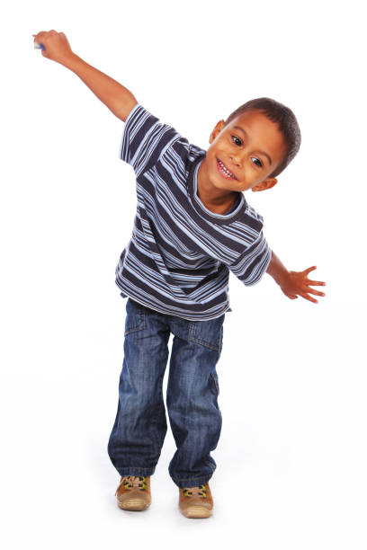 Black kid in jeans and shirt stock photo