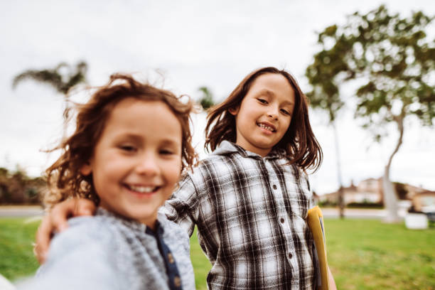 istock two kids take a selfie together 1139476871