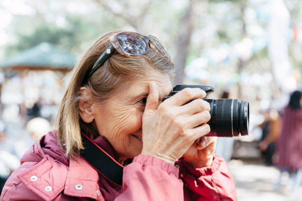 istock Senior woman taking pictures 1139476908