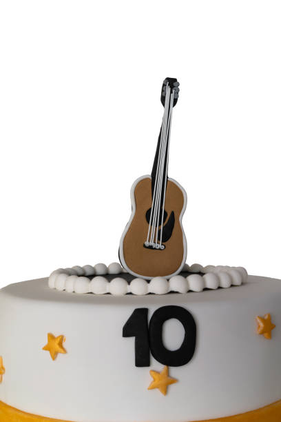 istock cake decorated with number ten and guitar on white background 1139477458