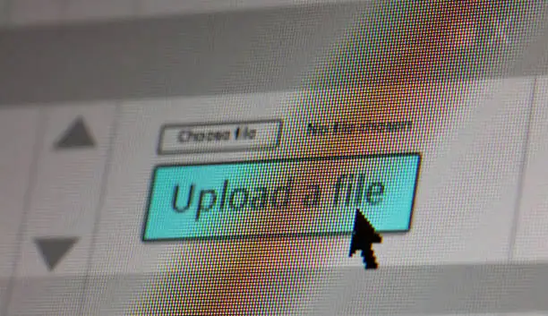 Photo of Upload a file on computer screen. Closeup screenshot, screen pixels and cursor pointer