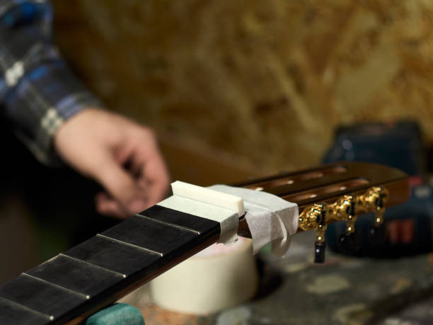istock In the guitar workshop, Guitars Luthiers installs Nut. 1139481420