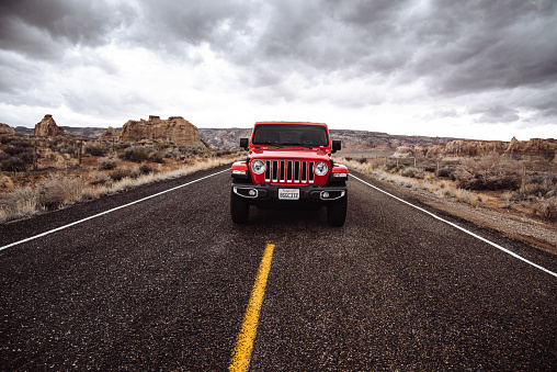 Page, Arizona, United States - March 6, 2019: Photo of a Jeep Wrangler Sahara 2019 edition parked in the centre of the road in Page, Arizona on a cloudy day. It is the new wild offroad vehicle by Jeep.