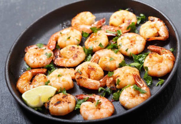 istock pan of grilled shrimps with lime 1139482048