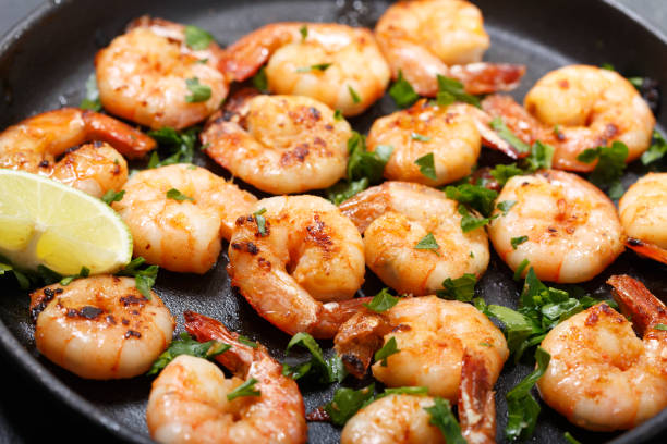 istock pan of grilled shrimps with lime 1139482050