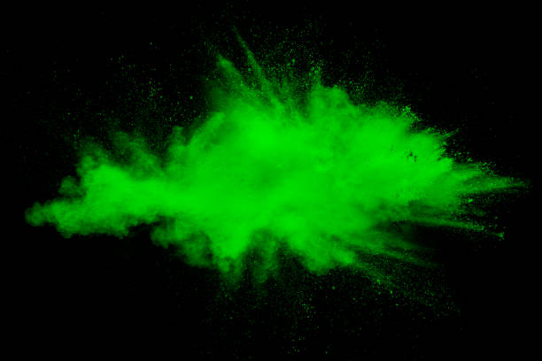 istock Green color powder explosion cloud on white background. Green dust splash. 1139490439