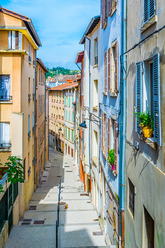 a narrow street in the historical center of Vienne, France