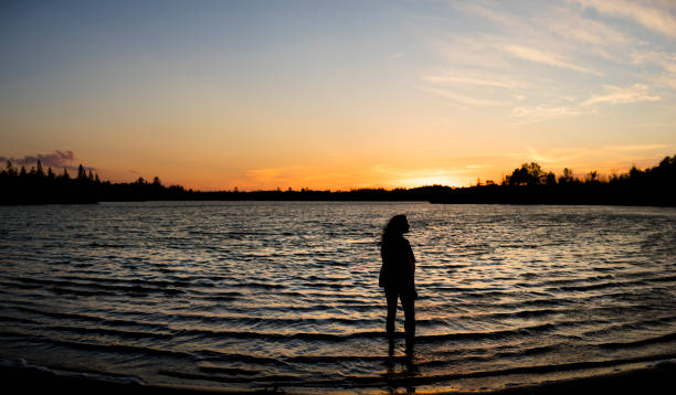 istock Beautiful Woman Wading 1139495644