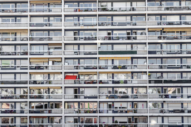 Huge anonymous concrete residential complex with windows and balconies - one like the other