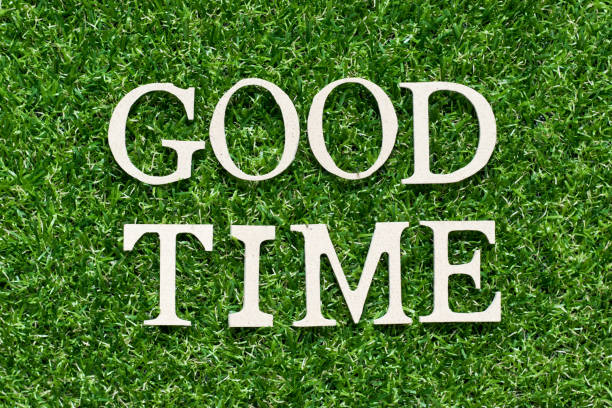 istock Wood alphabet letter in word good time on artificial green grass background 1139496578